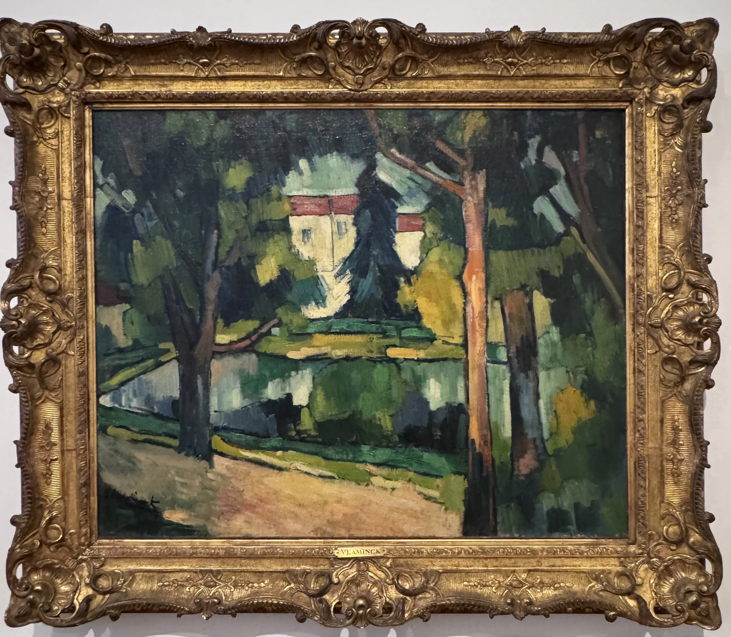 A post=Fauvist landscape by Vlaminck, with the color palette and forms clearly influenced by Cezanne.