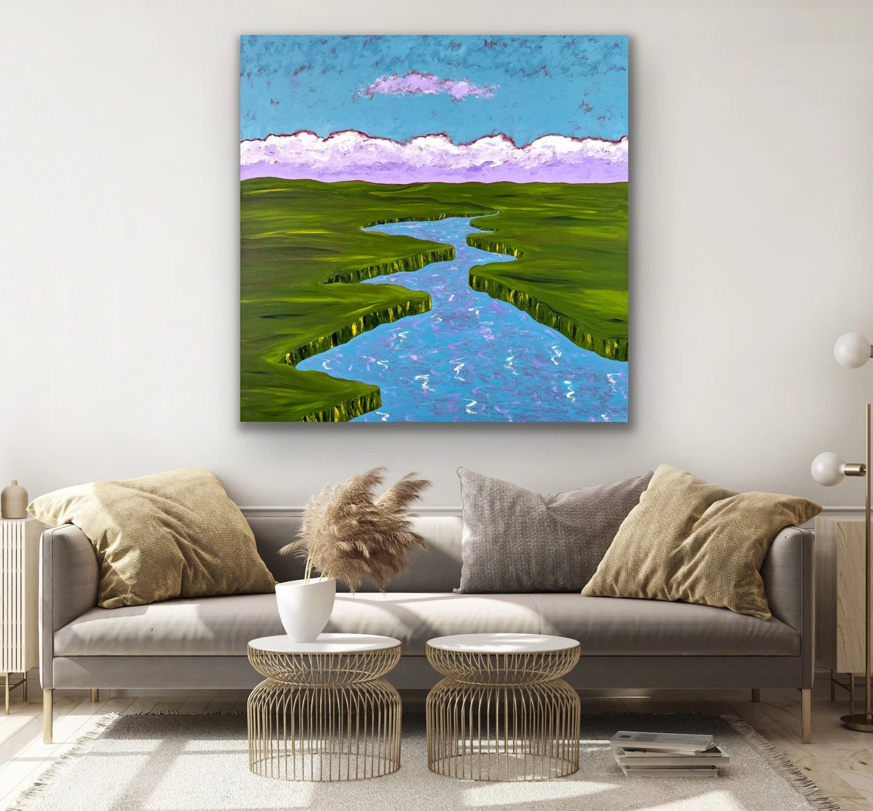 A lush green summer marsh, captured in the early morning hours with soothing purple clouds floating on the horizon and reflecting on the water.