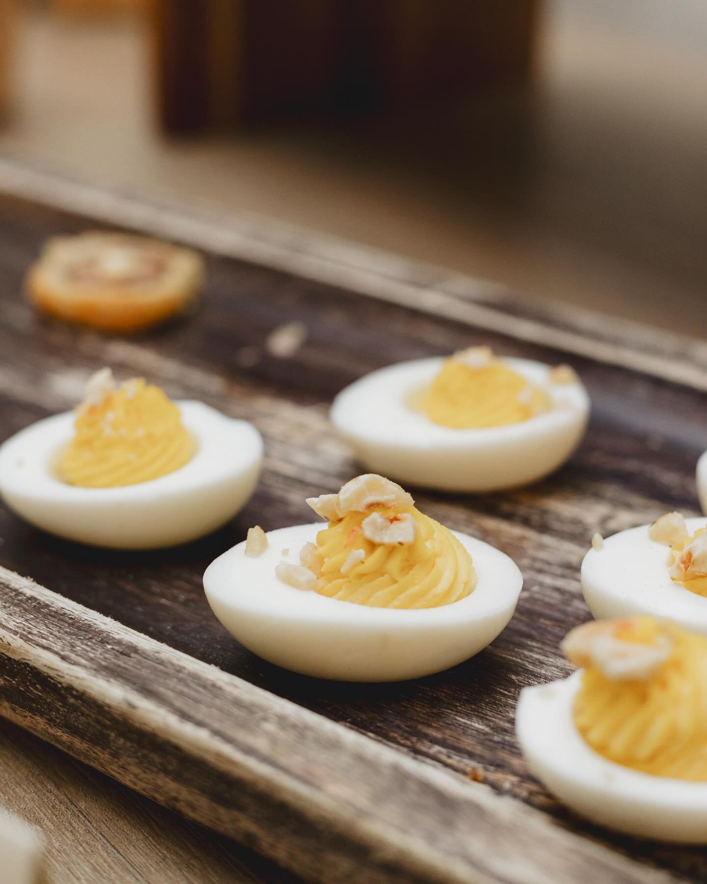 Meyer Lemon Deviled Eggs w/ Toasted Hazelnut &amp; Pink Sea Salt #SkoposCatering #WoodRidgeNJ #NJCatering #NYCatering #PassedAppetizers #Wedding #Catering #ProductionCatering #FilmCatering #TVCatering #DeviledEggs