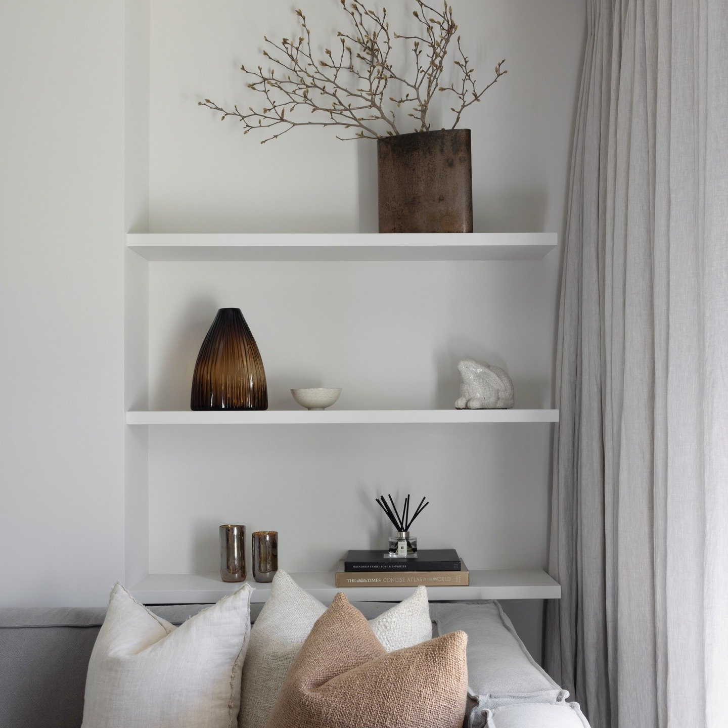 When built-in shelving is considered from the start, it becomes part of the architecture rather than an afterthought. 
In this Chambers Street renovation, the nook was designed to quietly showcase a few treasured items, adding warmth and personality 