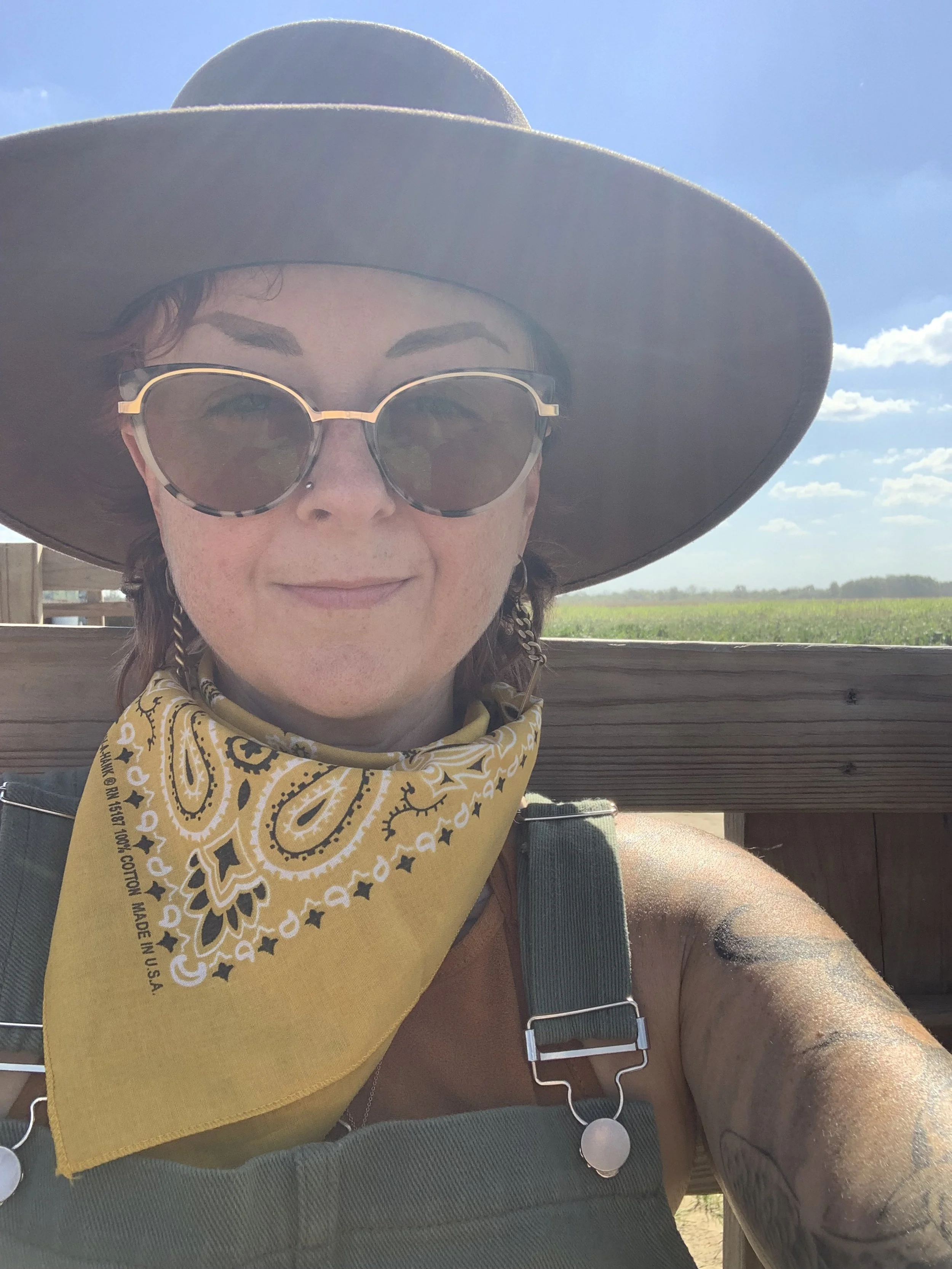 Deanna, a meditation teacher, smiling at the camera in the studio.