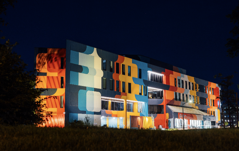 Mainframe Studios exterior at night with lighting.