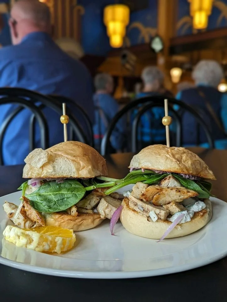 Two Greek Chicken sliders on a plate