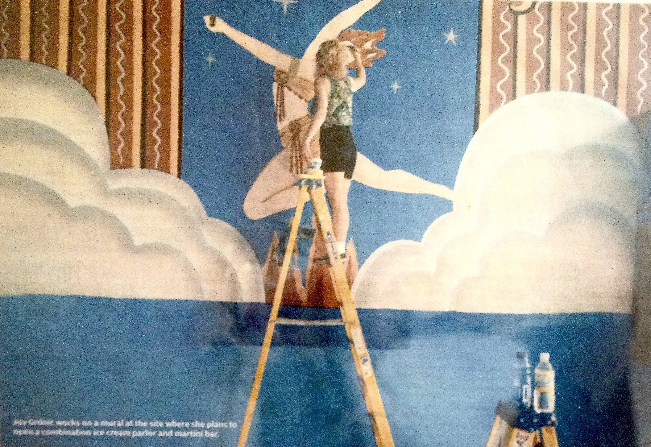 The Fountain on Locust founder Joy Grdnic works on a mural inside her ice cream parlor and martini bar.