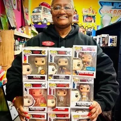 Carmen selling Funkos at Hawkins Headquarters