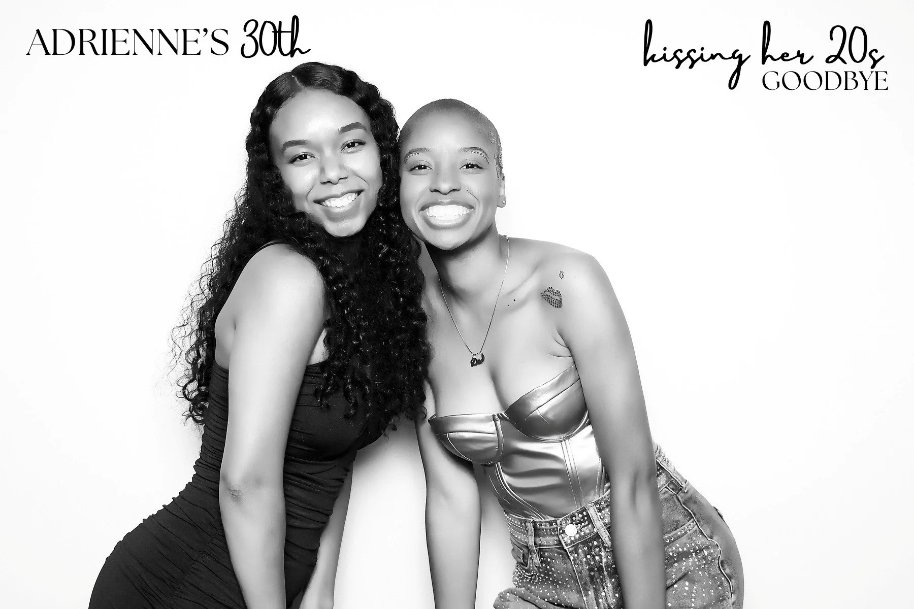 Two young women smiling and hugging, one wearing a strapless top and the other a form-fitting dress, against a plain background. Text in the image reads "Adrienne's 30th" and "Kissing her 20s goodbye" photo booth picture.