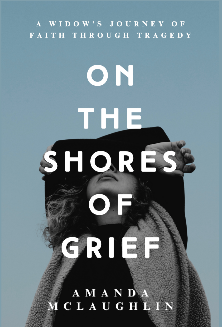 A black and white image of a woman folding her arms over her face with a blue blackground