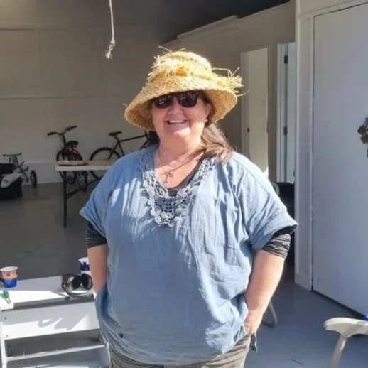 Woman in straw hat smiling
