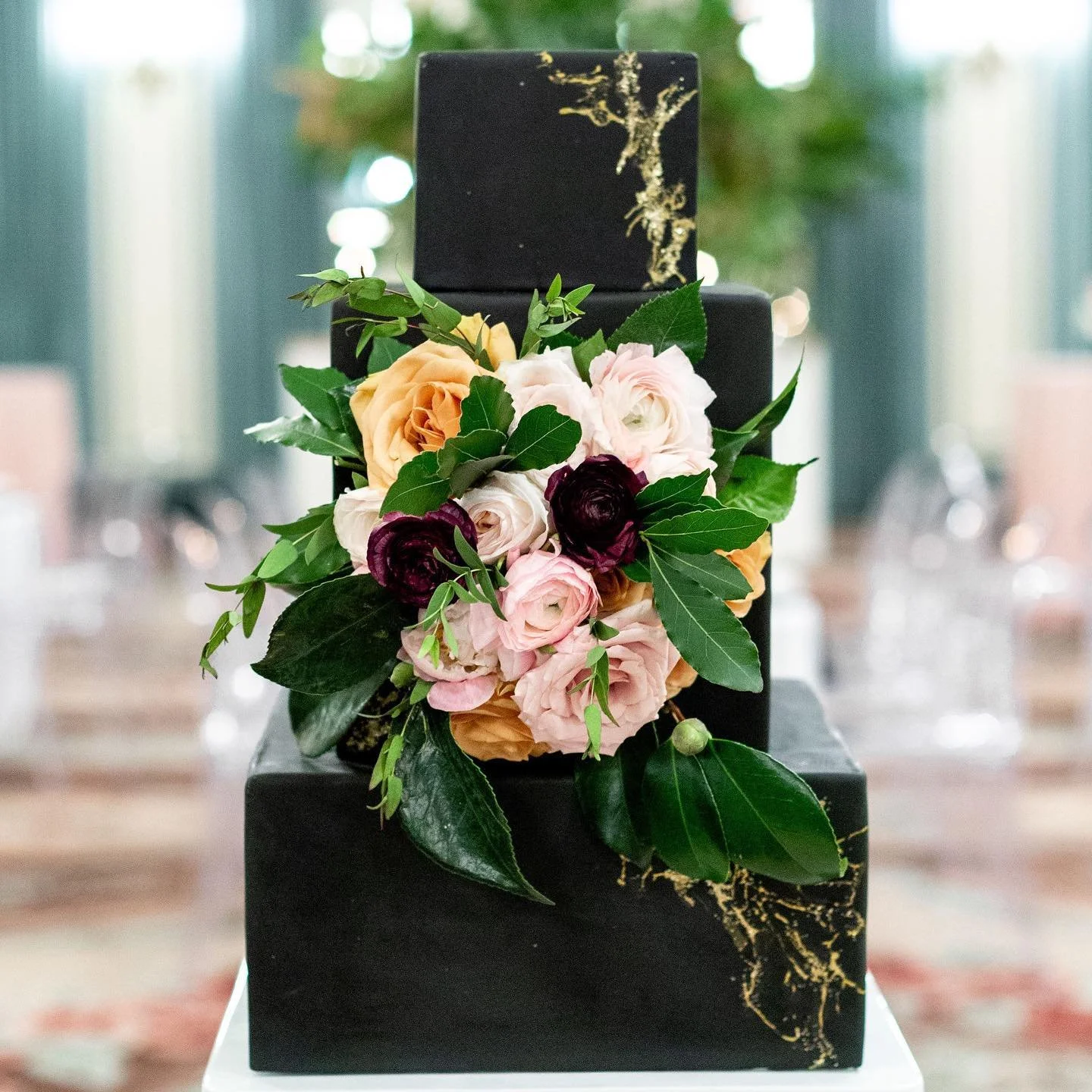 Black cake with peach roses