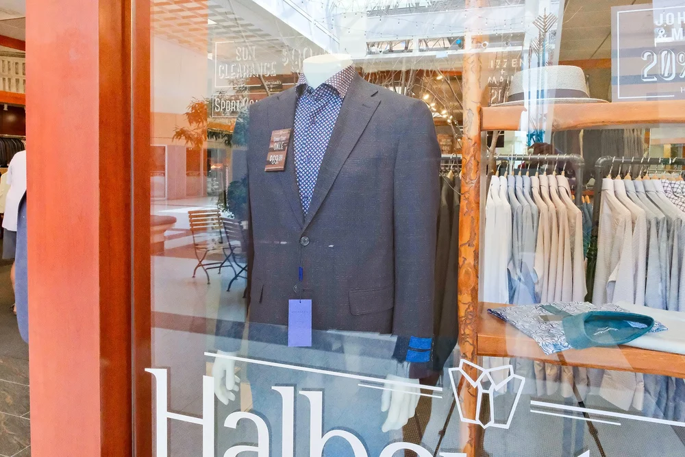 Navy Platinum Sport Coat with a dress shirt on a mannequin in the Halberstadt's window