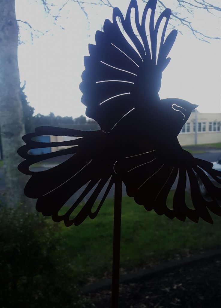 Fantail-in-Flight-Corten-on-tall-Rod.jpg