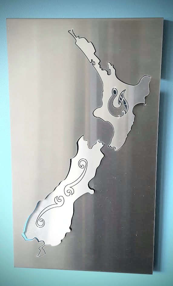 NZ Map with maori design - teal background.jpg