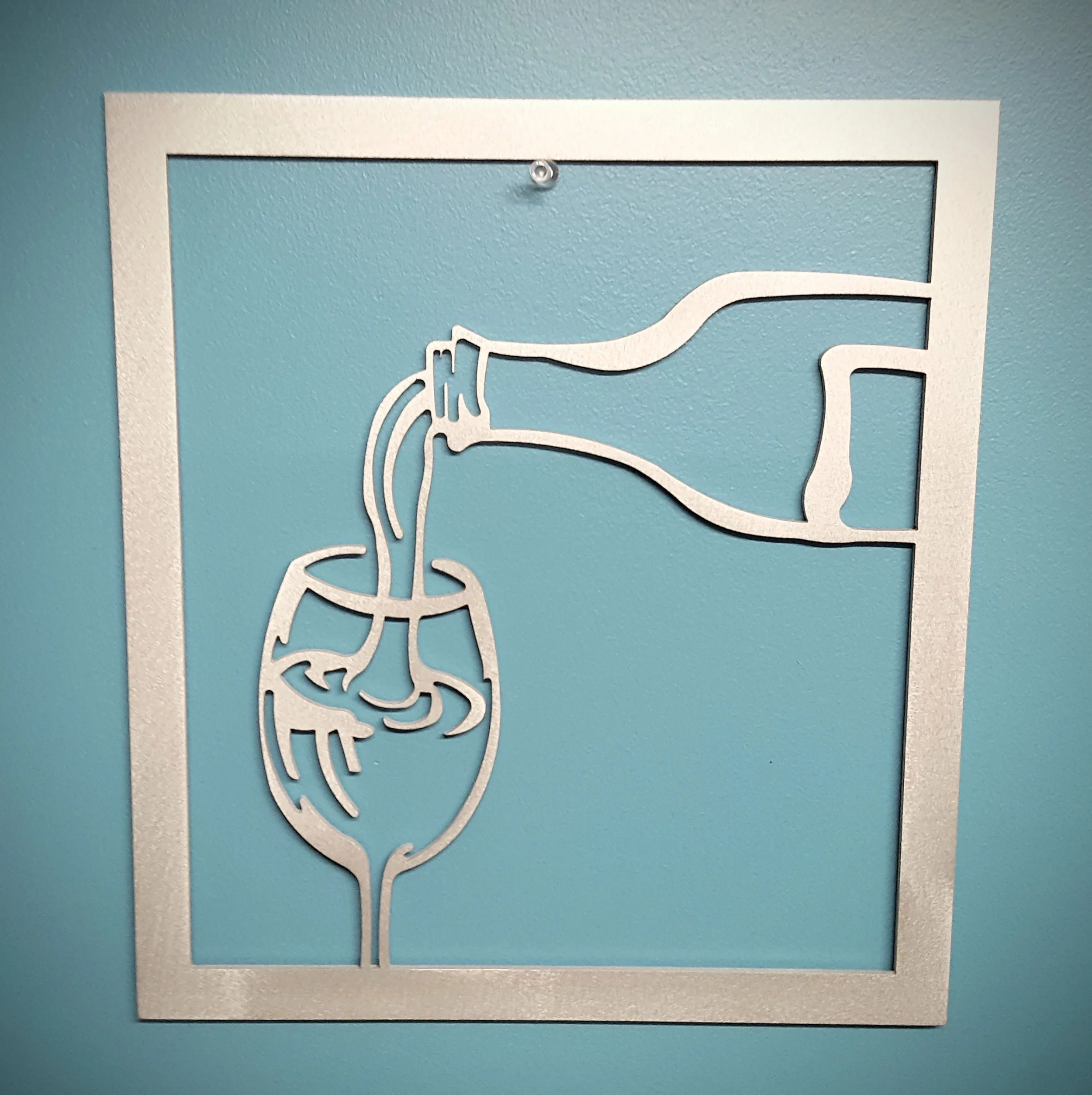 Wine bottle pouring into glass.jpg