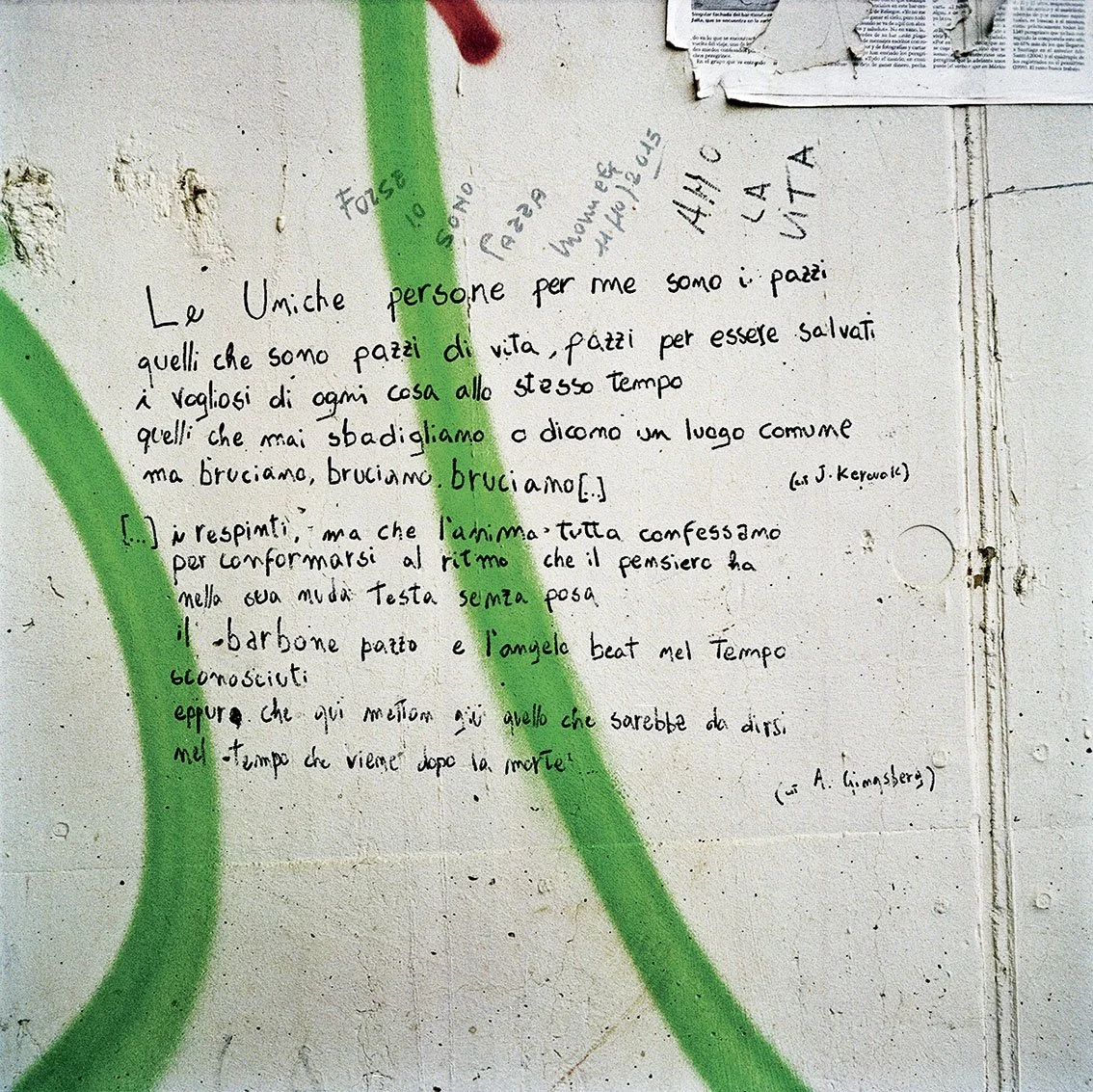 A handwritten quotation on a white wall, with green paint marks and a piece of paper in the top right-hand corner. The quote speaks of the person as the only one for the author, who is a reflection on life and death.