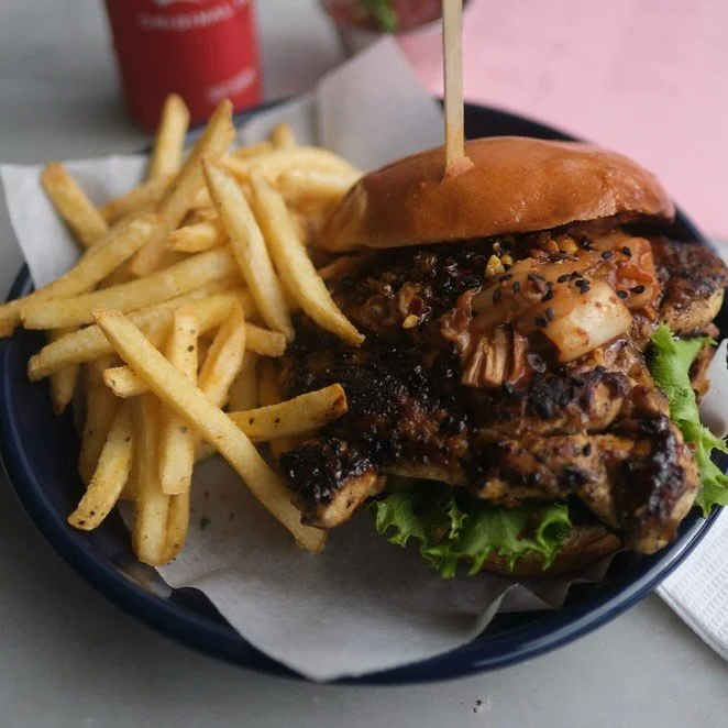 Come and try our deliciously decadent Kimchi Chicken Burger 🍔 Served with mayo, chilli crisps &amp; fries 🌞❤️

@t.h.e.p.o.w.e.r.a.b.o.v.e #thepowerabove #restaurant #cafe #bar #capetown #southafrica @all.yours.co