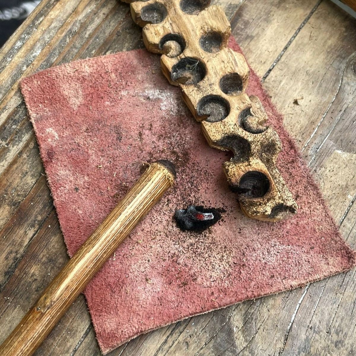 The hand drill with its small ember.
