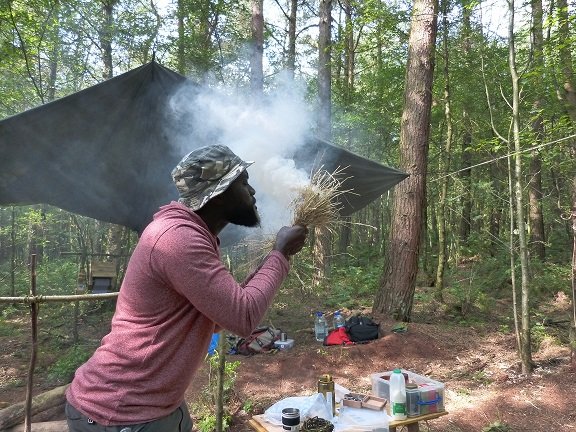 A tinder bundle about to burst into flame on our Introduction to Bushcraft Course