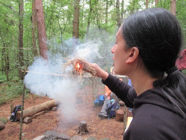 Breathing life into a tinder bundle on our Introduction to Bushcraft course