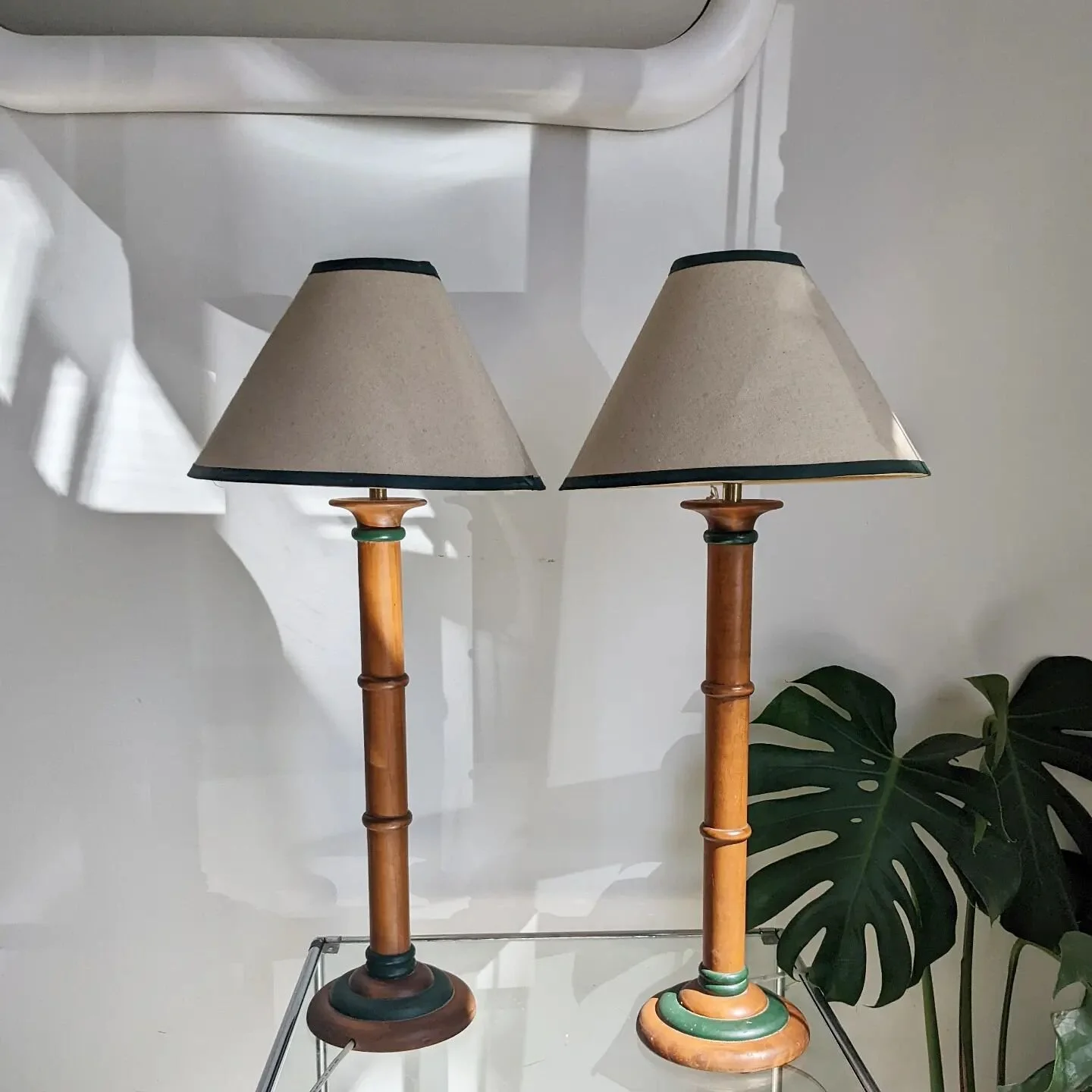 [SOLD] Tropic wonder.

Pair of vintage, hand-turned wooden lamps with green trimmed, cream shades. Almost tall enough to keep on the floor or place on a lamp table, sideboard or bench. Beautifully made pieces, their shades have clear good sides. The 