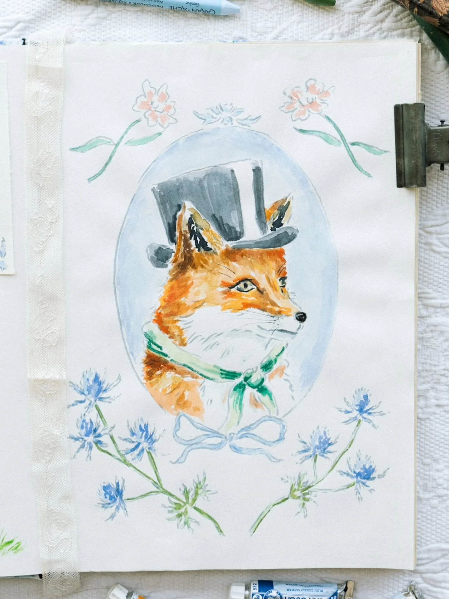 The fox, in his tall black hat and mossy green scarf, looks as if he's on his way to something rather important 🎩

#illustration #watercolorillustration #storybookillustration #woodlandart #whimsicalart