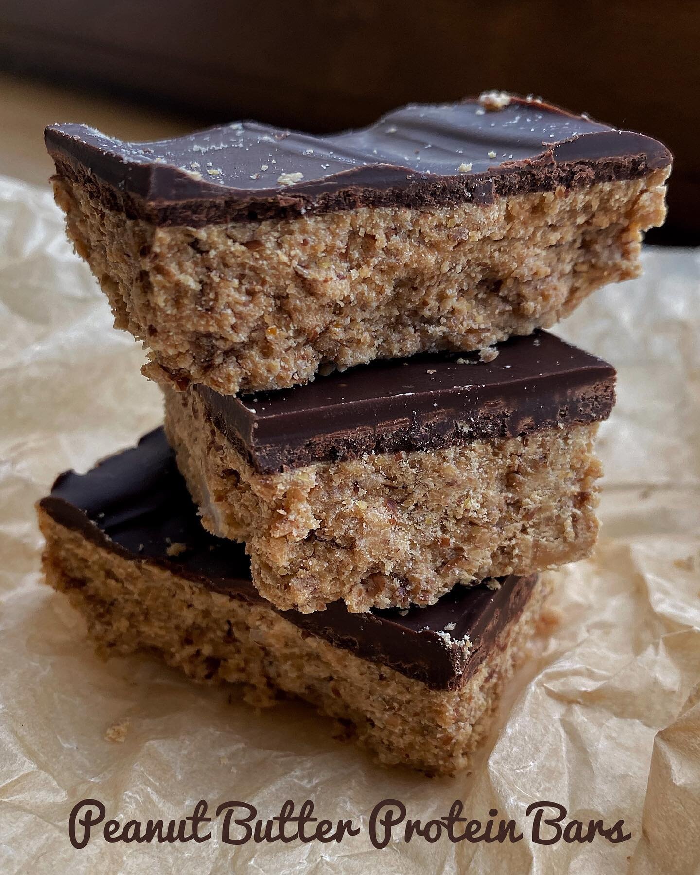 Peanut Butter Protein Bars 
3/4 cup creamy peanut butter 
1/4 cup honey or maple syrup
1 tbsp melted coconut oil
1 tsp vanilla
1/3 cup ground flaxseed
1/2 cup vanilla protein powder or unsweetened milk powder 
60g dark chocolate
In a bowl mix togethe
