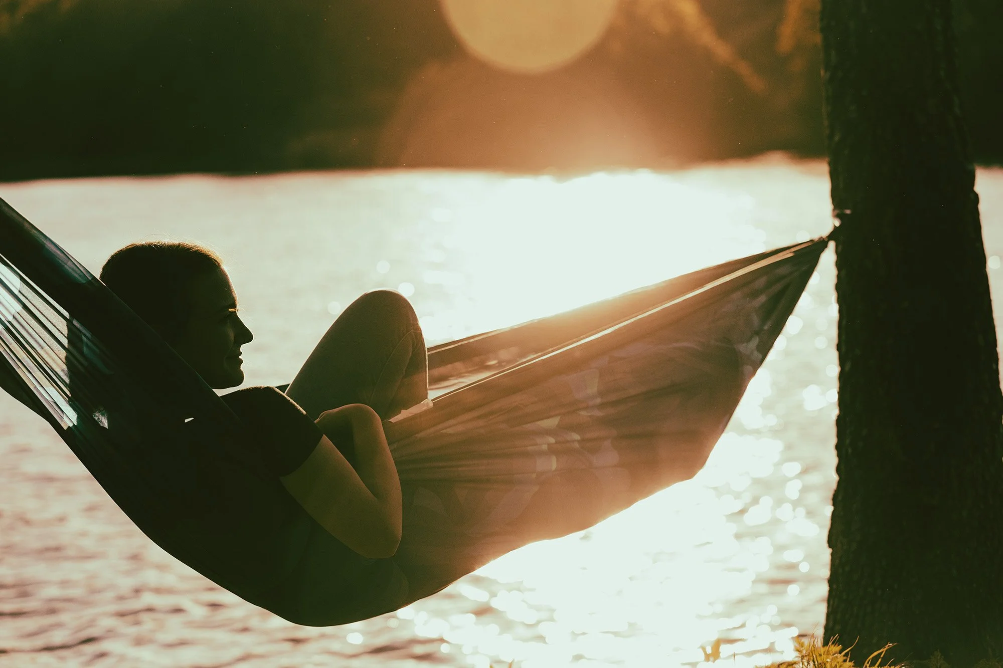 Relaxing in a hammock at sunset