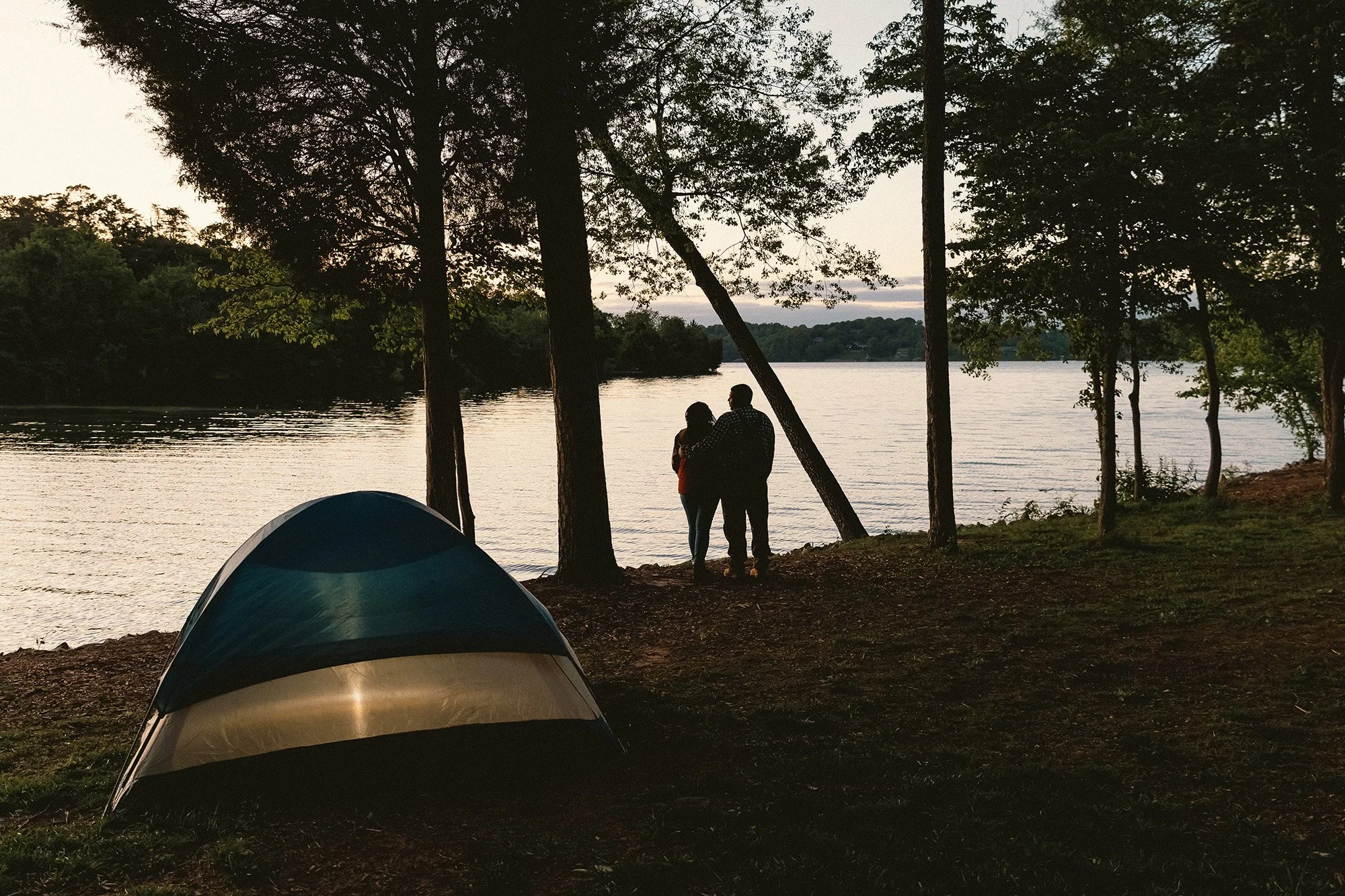 Camping by the lake at dusk
