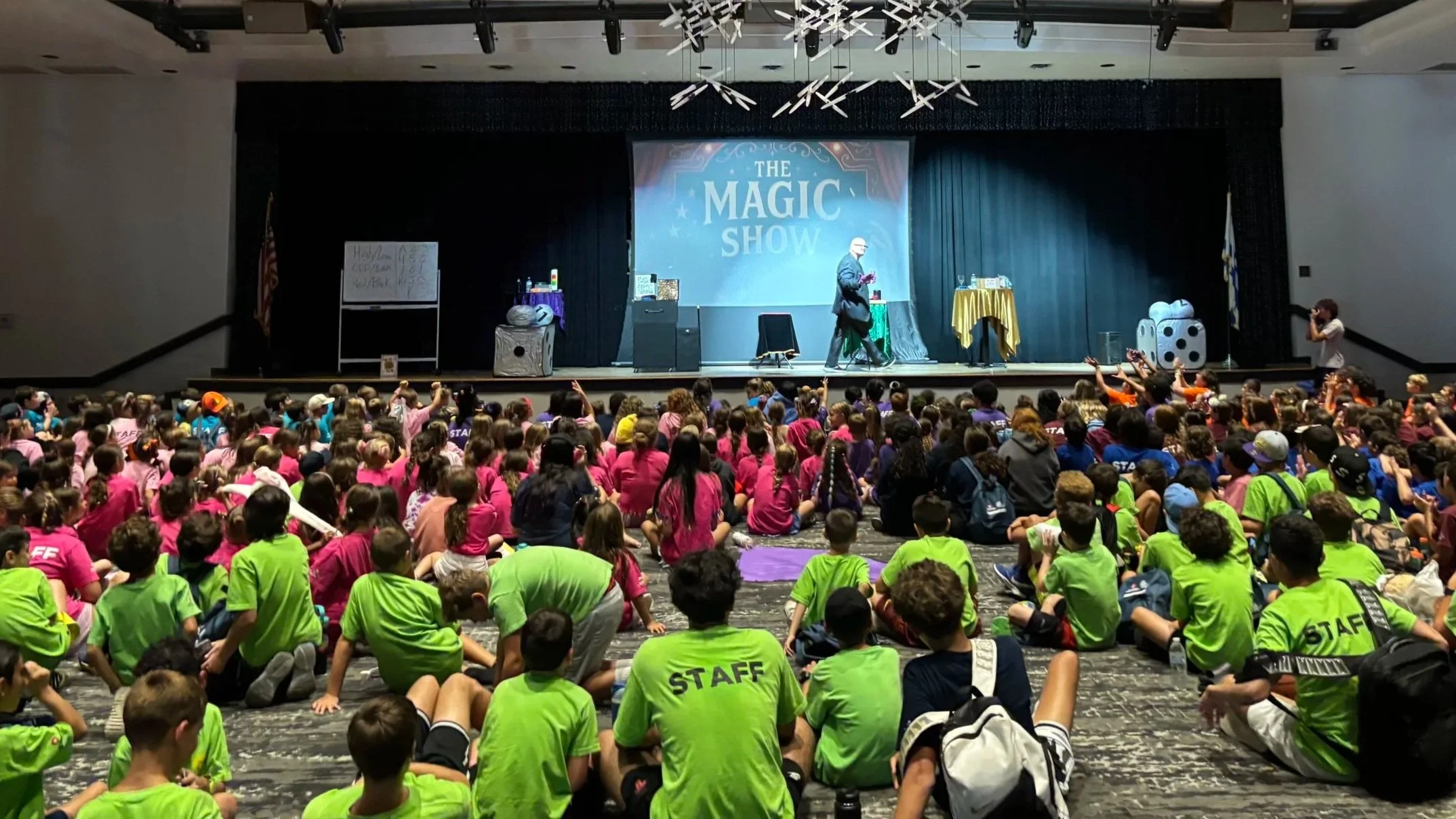 Award-winning magician Big Joey Magic Showy performing a live stage magic show for summer camp campers and counselors.