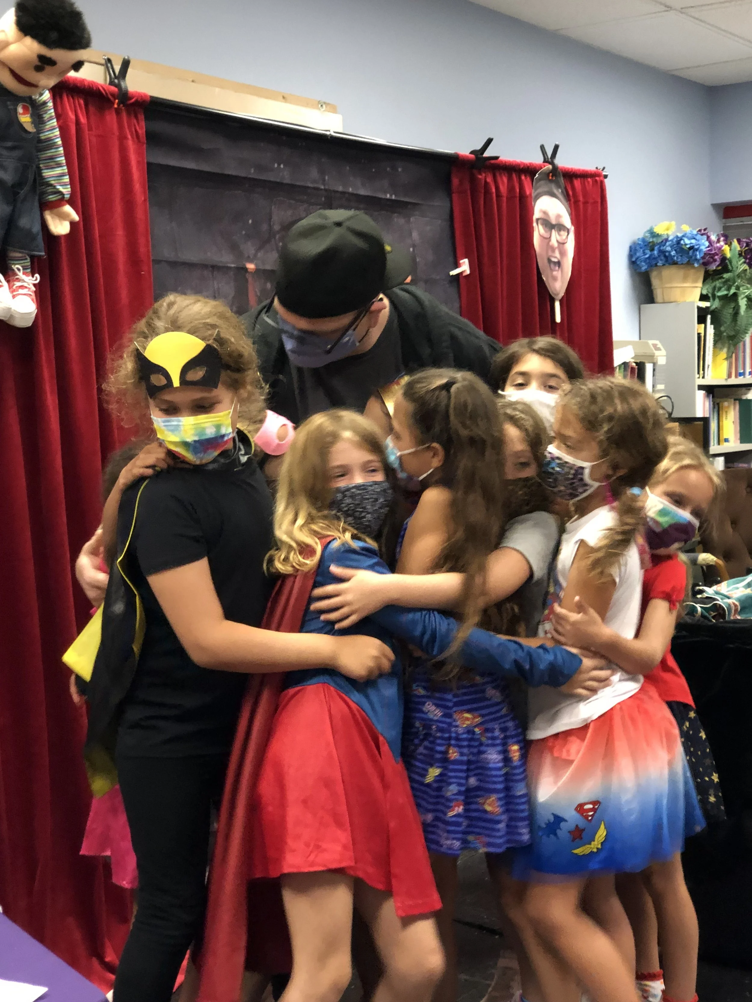 Magician entertaining kids during magic show