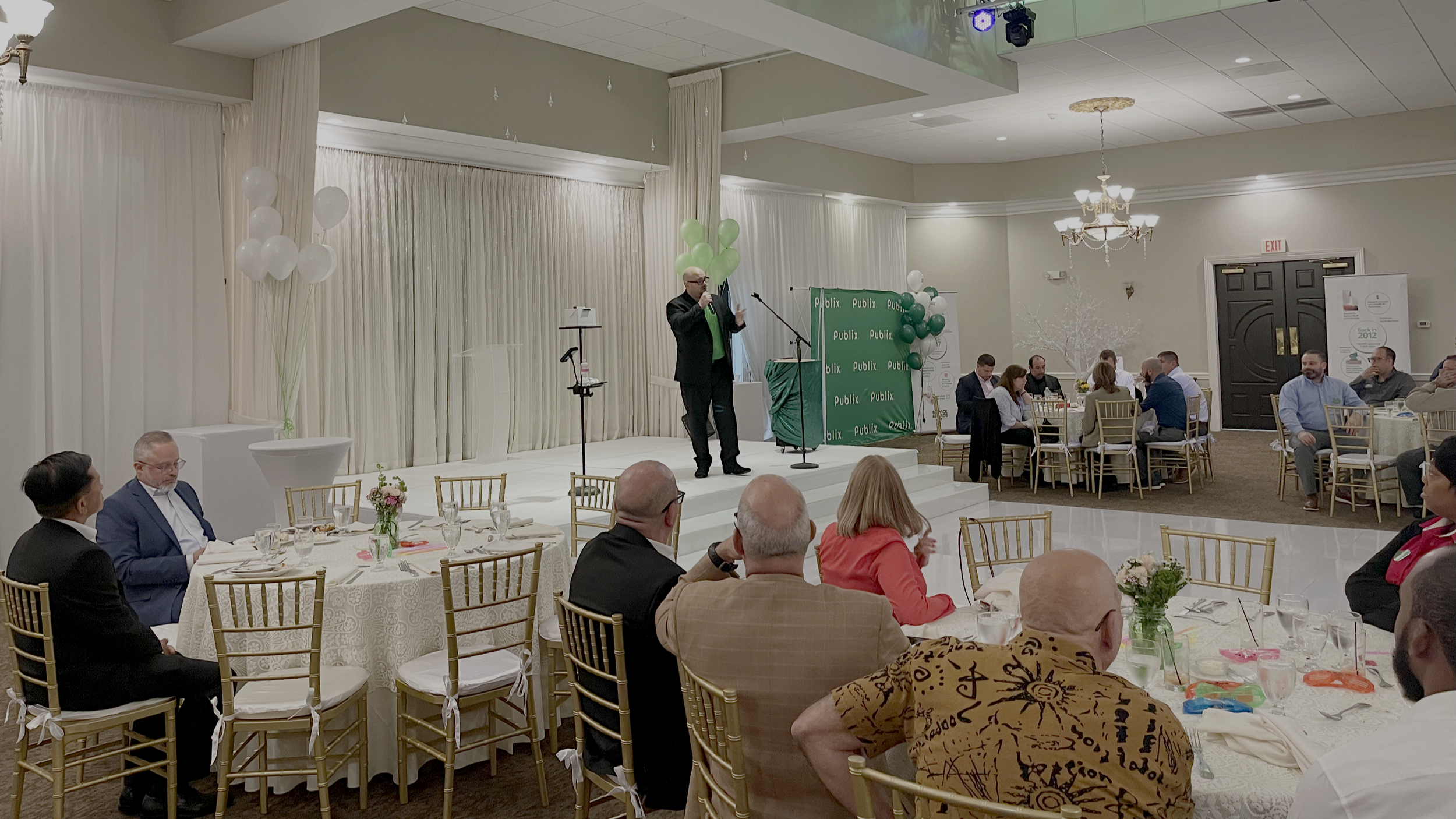 Corporate magician Big Joey Magic Showy performing interactive magic and mentalism for a live audience at a South Florida corporate event.