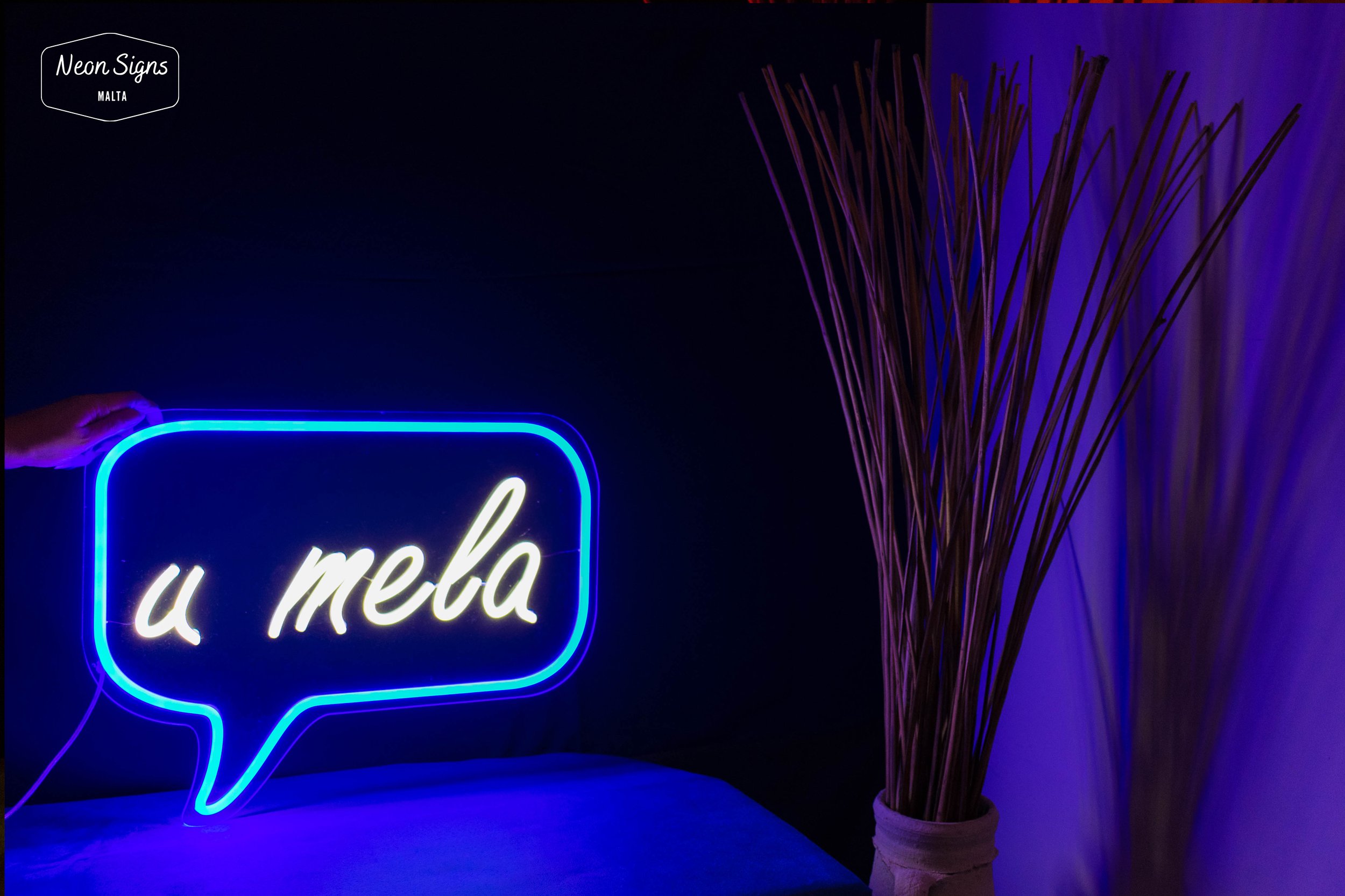Our conversation starter "U Mela"
Dimensions: H:40cm X W:50cm
Colours: Aqua Blue and Pure White
Bright neon sign in a text bubble having facebook's colour scheme white and dark blue
