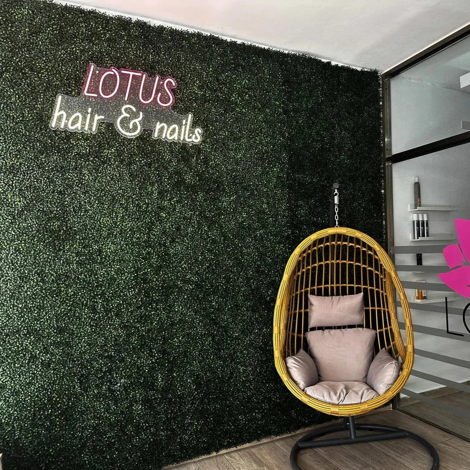 neon sign on wall at clients hair and nail salon