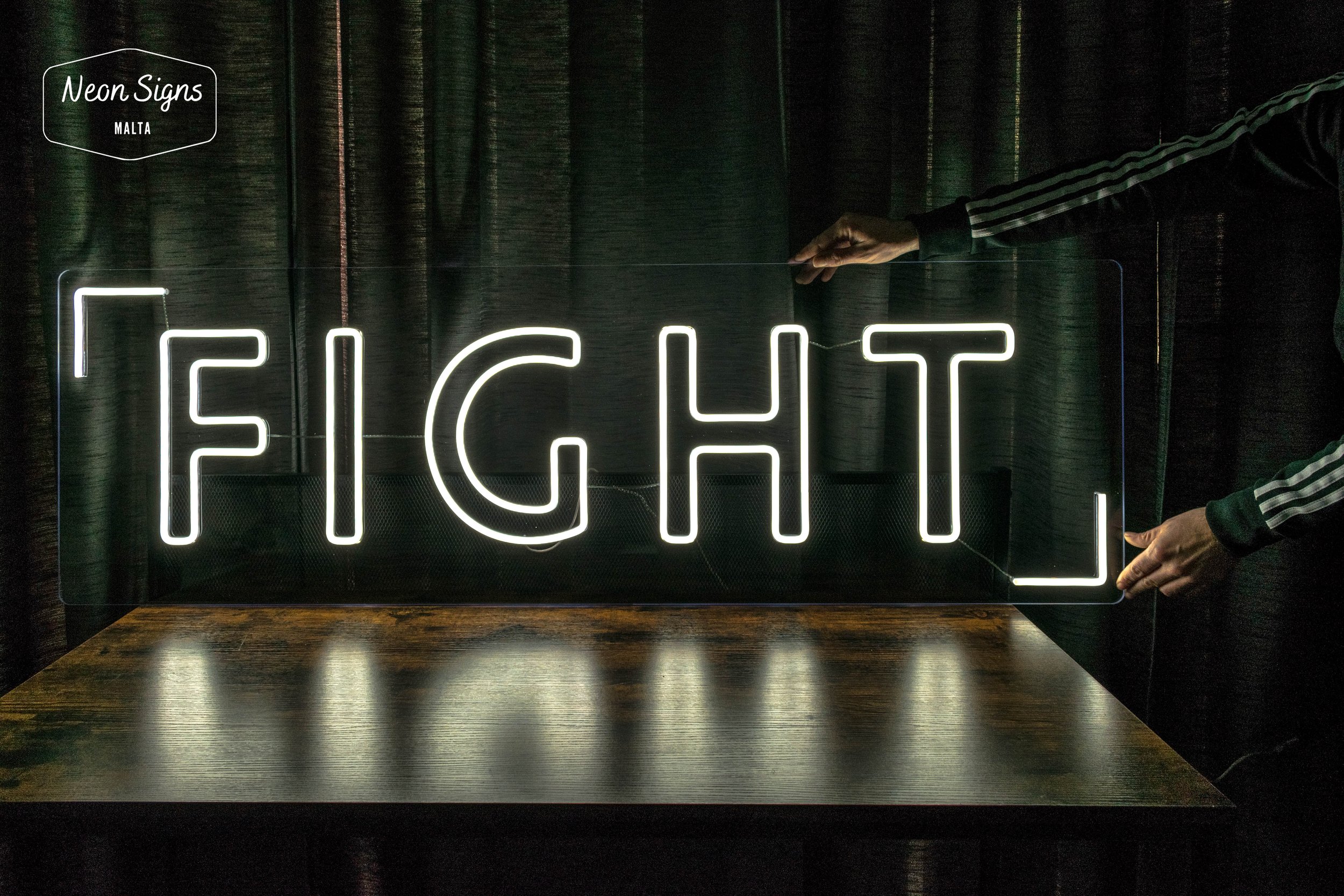Fight neon sign for a boxing fitness classes that are held up in st julians malta
