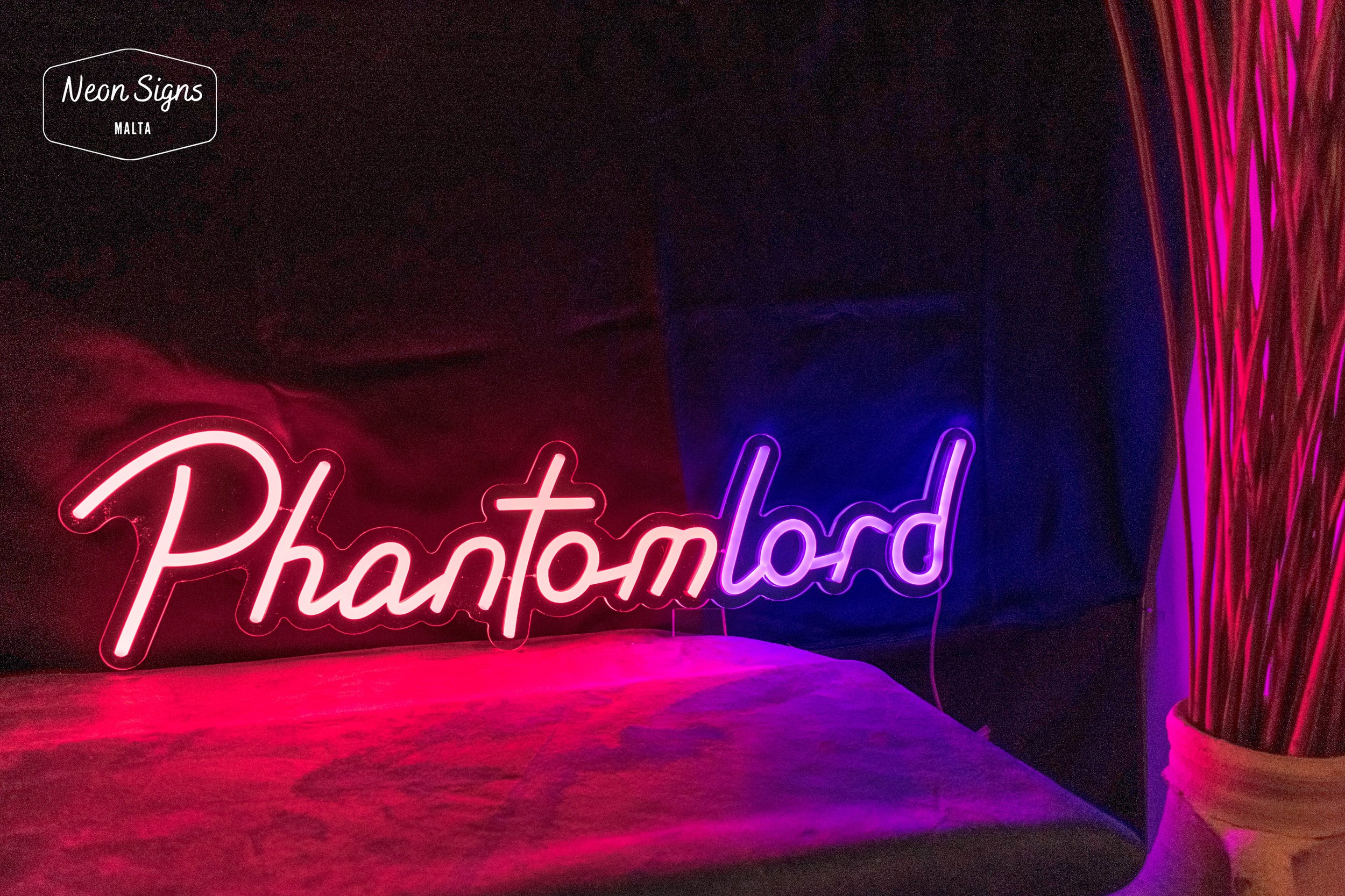 Two toned coloured neon sign with text phantom lord in red and purple which should light up the buyers twitch stream