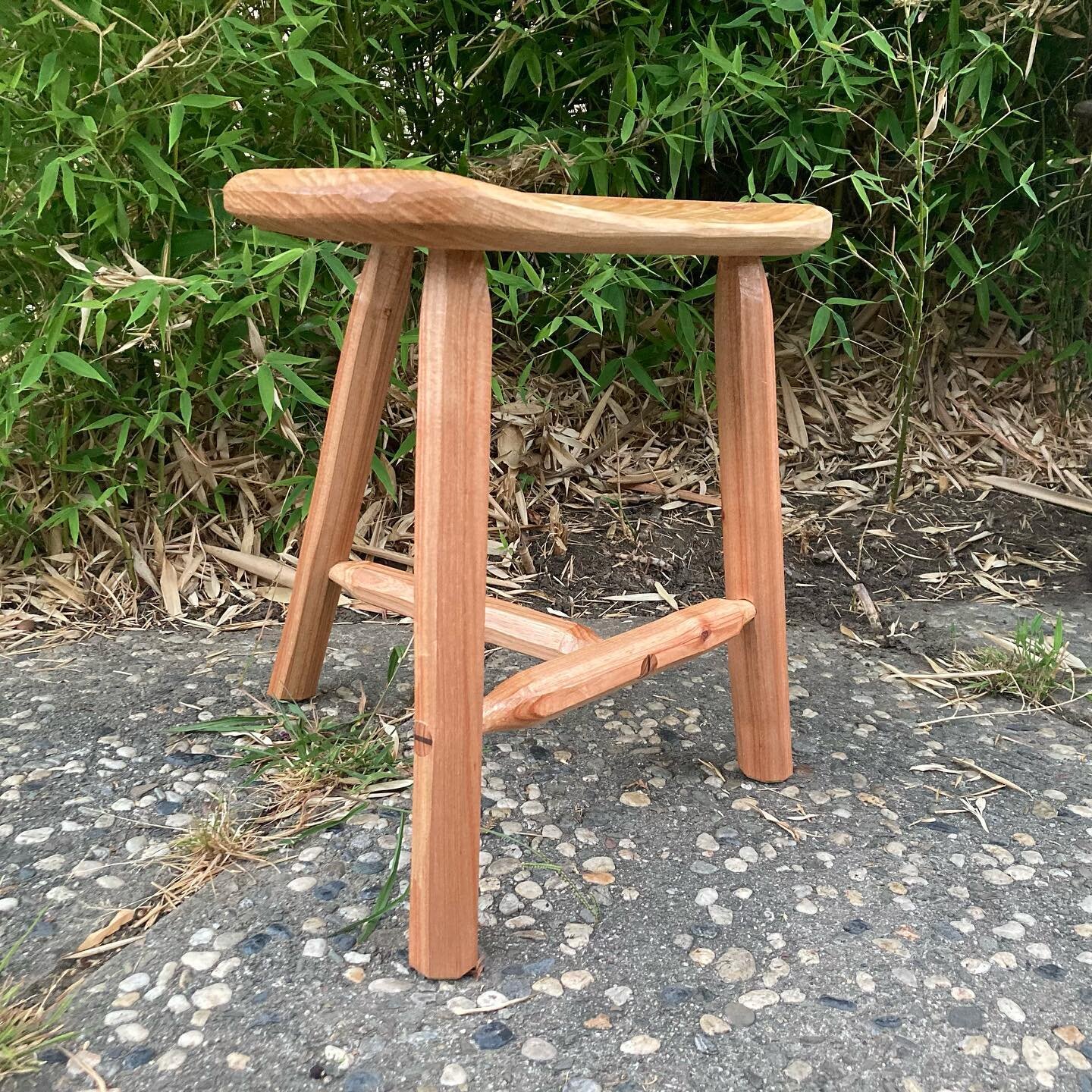 A rustic wedged tenon stool from local wood. Acacia and Monterey pine
