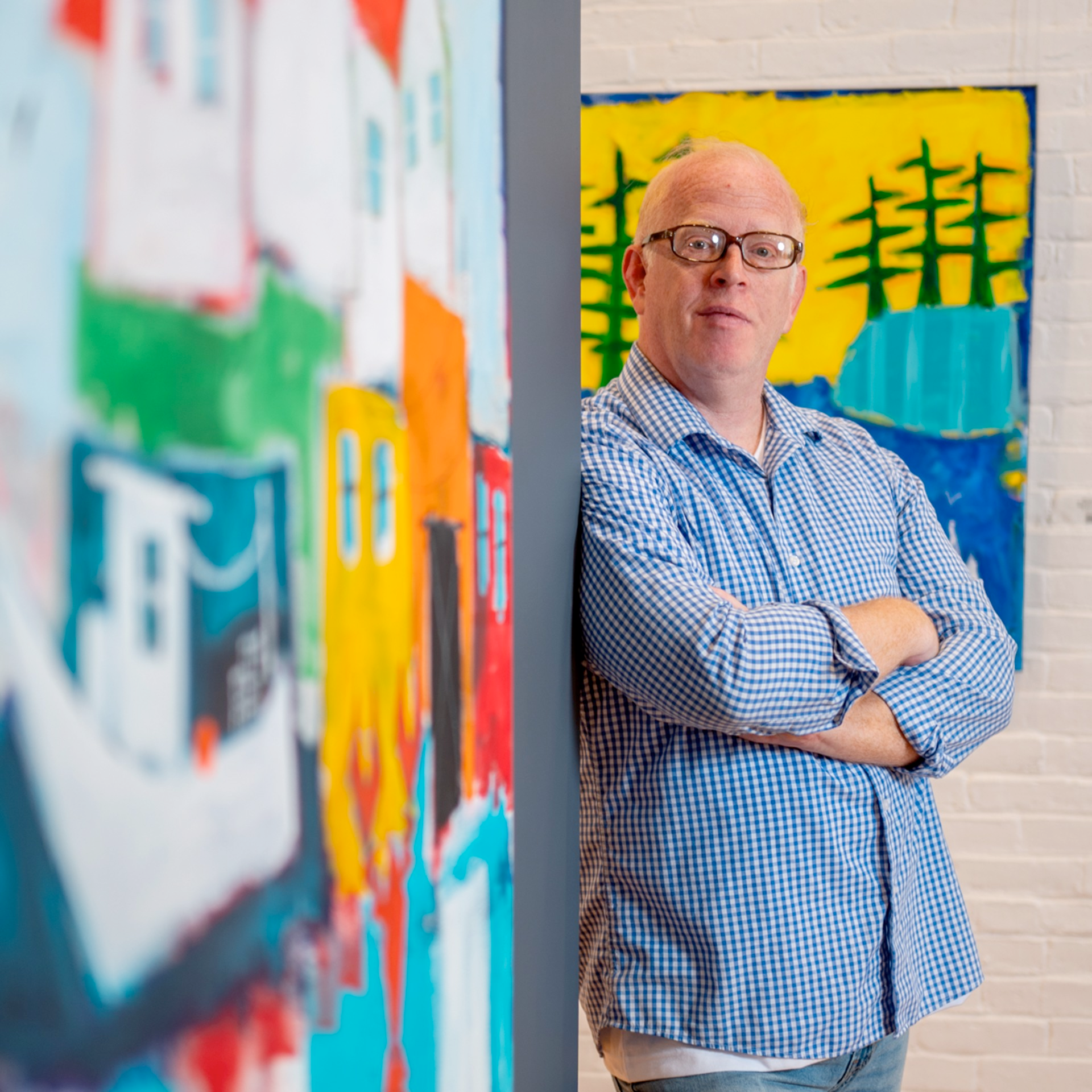 rick hamilton stand near paintings