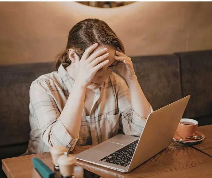 Overwhelmed female business owner