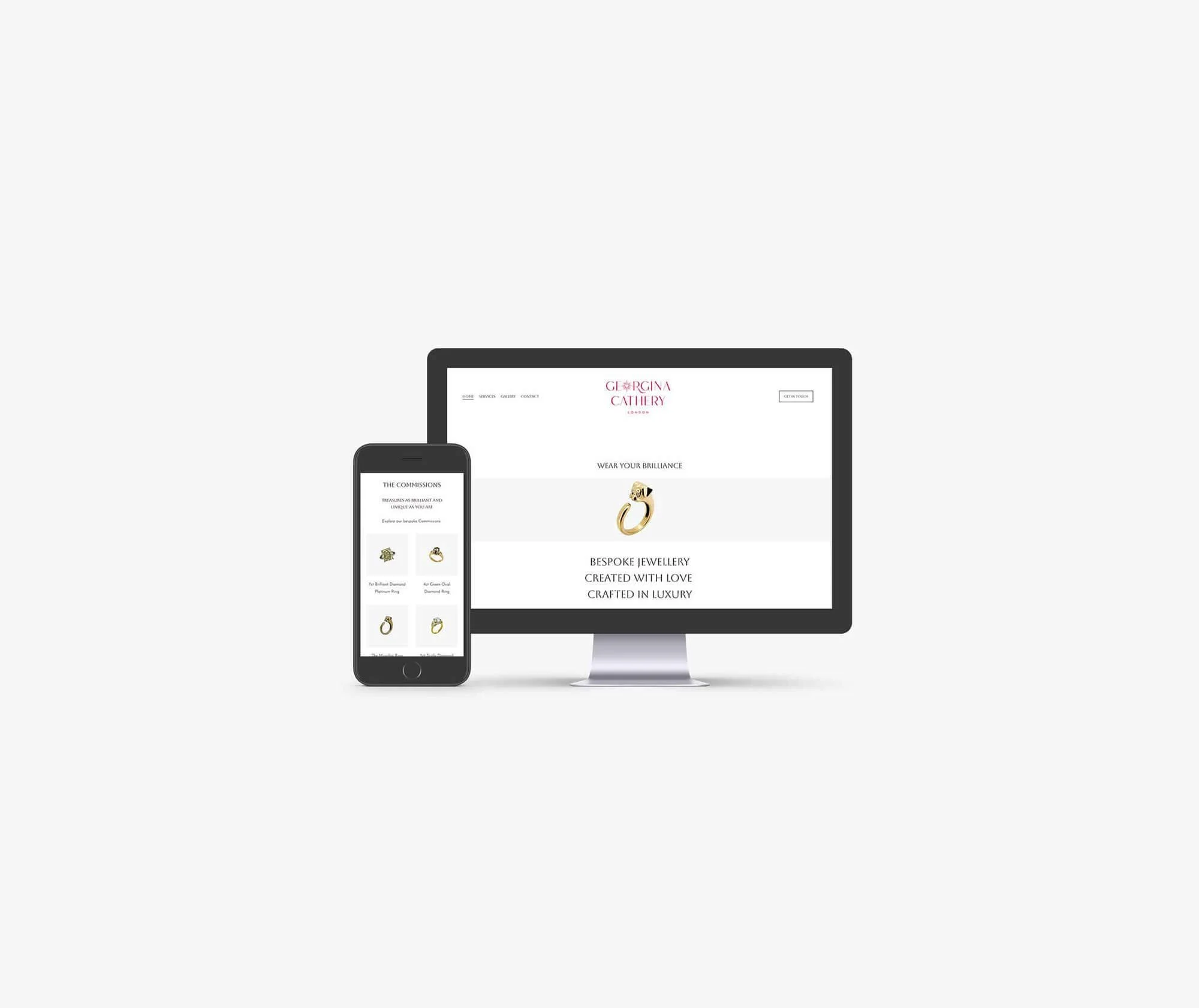 Website display of jewelry including rings and necklaces on screens of a smartphone and computer monitor.
