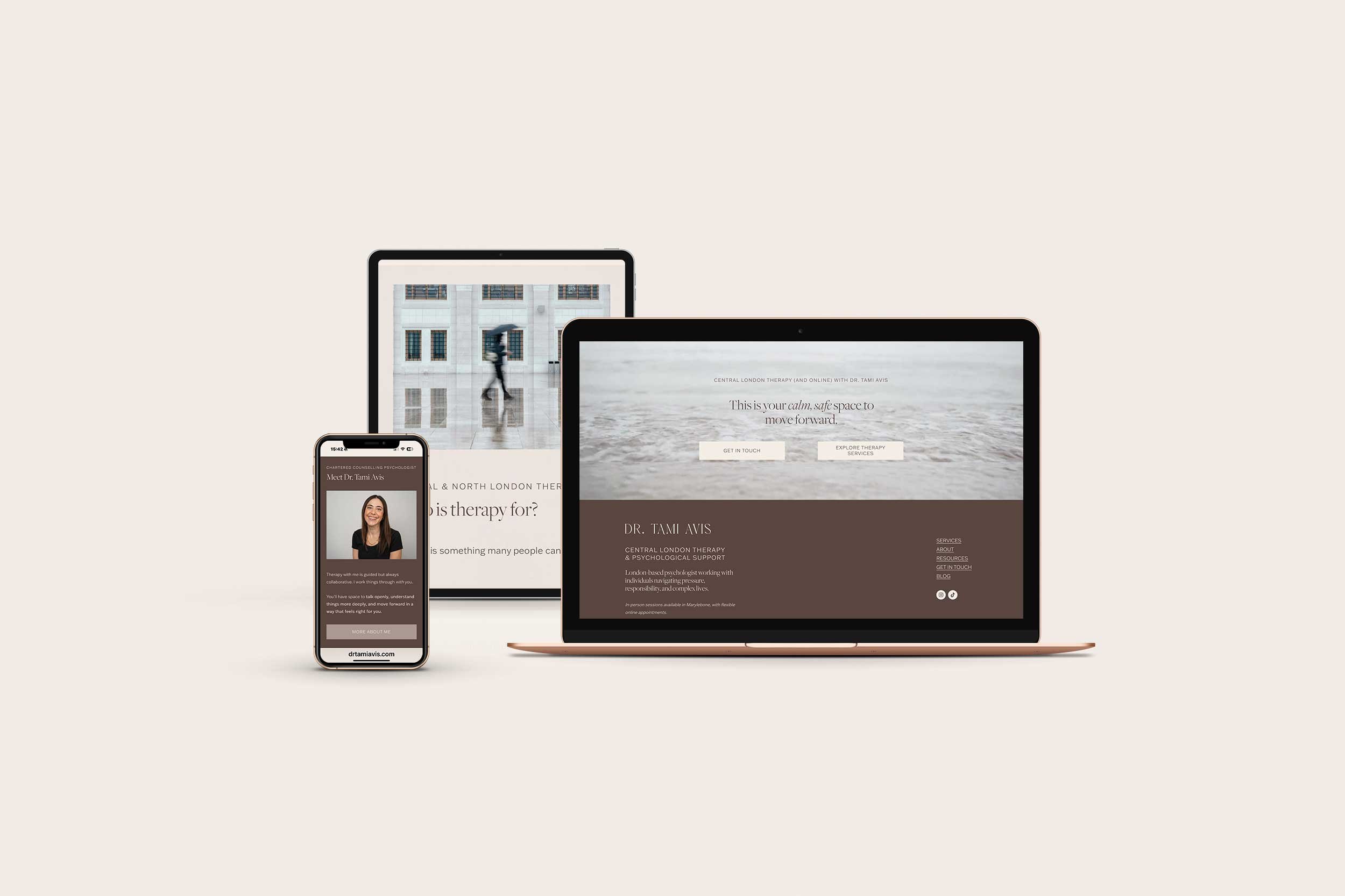 Multiple devices displaying a website for Dr. Tami Avis, a therapy and psychological support service, with a background of a building with windows and a person with an umbrella walking by.