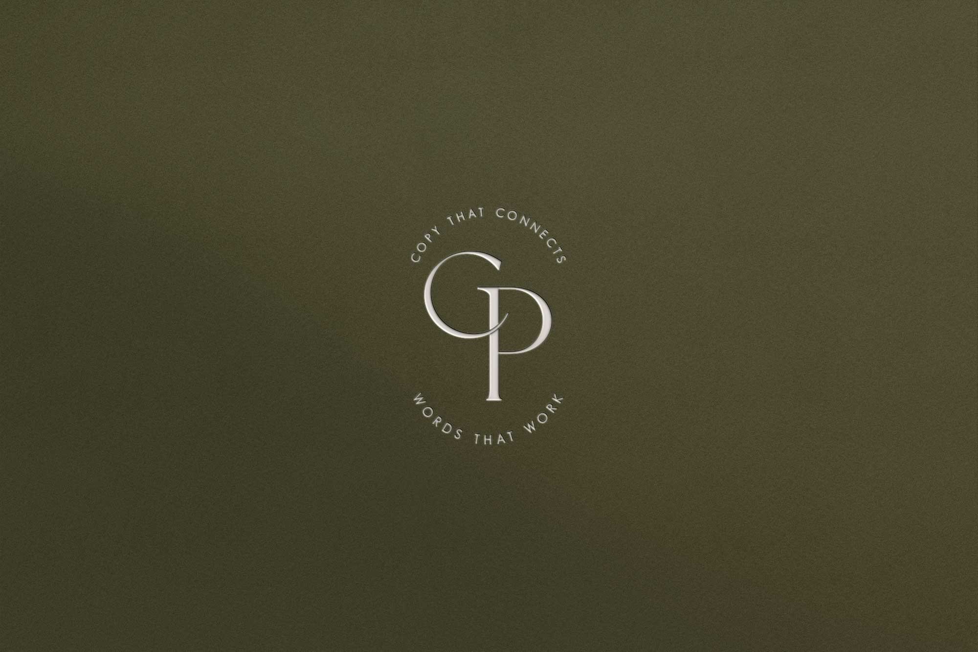 Close-up of a dark-colored background with the text 'COPY THAT CONNECTS' at the top and 'WORDS THAT WORK' at the bottom, surrounding a stylized logo with the letters 'C' and 'P' intertwined.