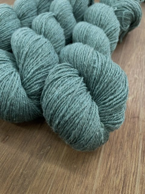 fingering weight sock yarn light dusty teal closeup