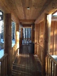 Covered breezeway to wood supply and toilet