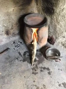 Preparing fire to bake barley/wheat bread