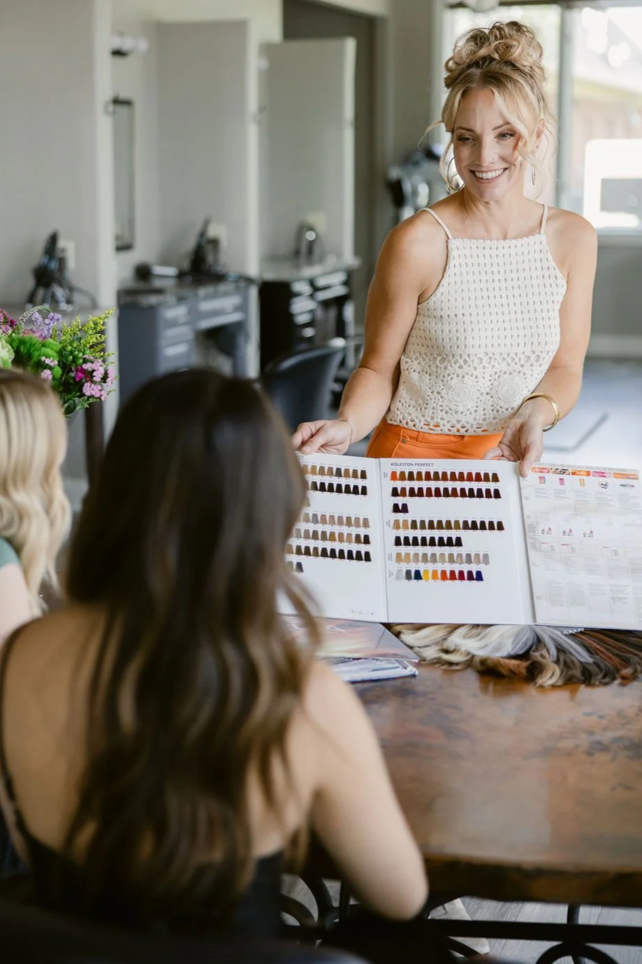 Kim Harper Salon's Education Director teaches a small group color class. 