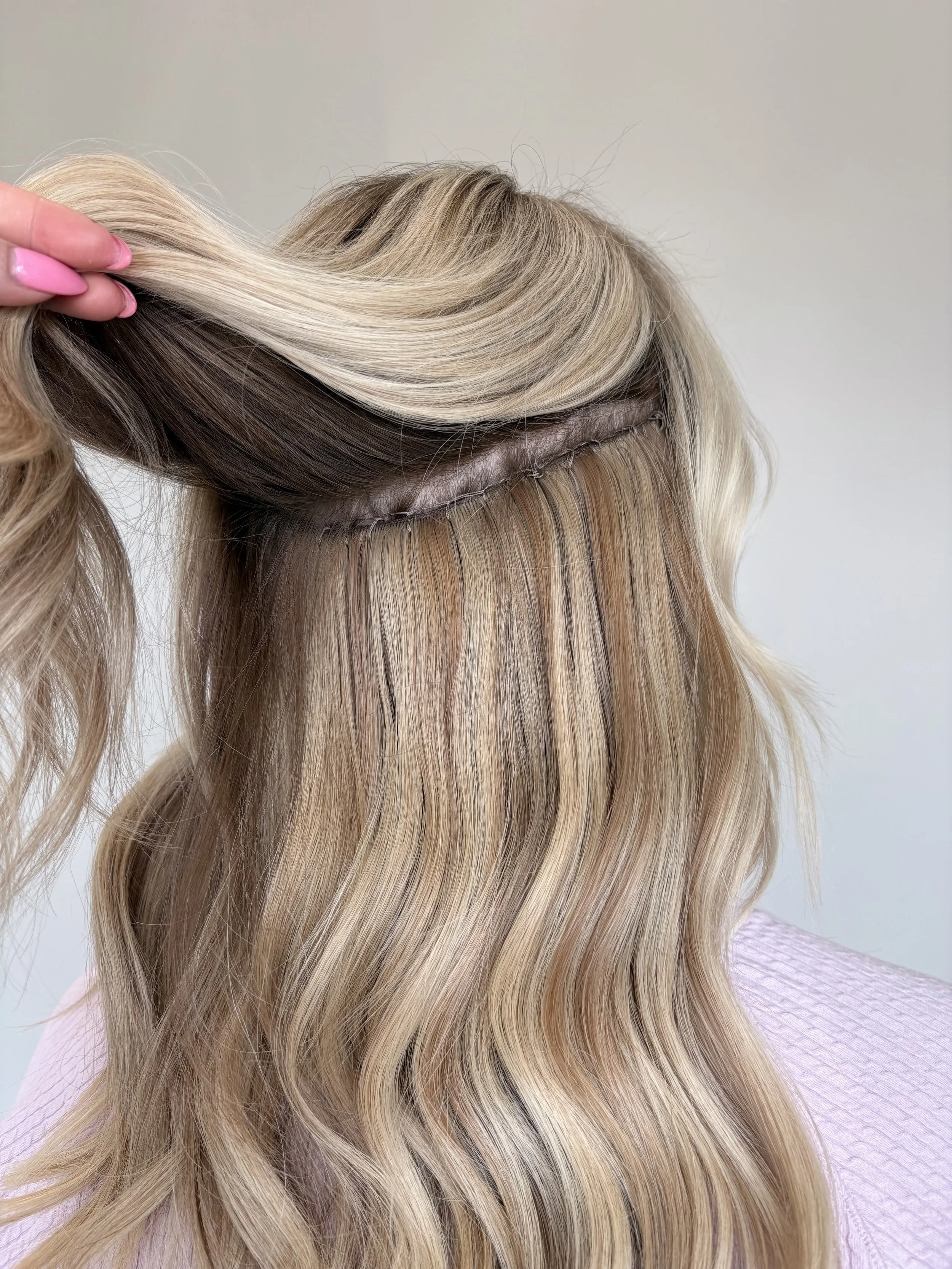 Sew in weft hair extensions