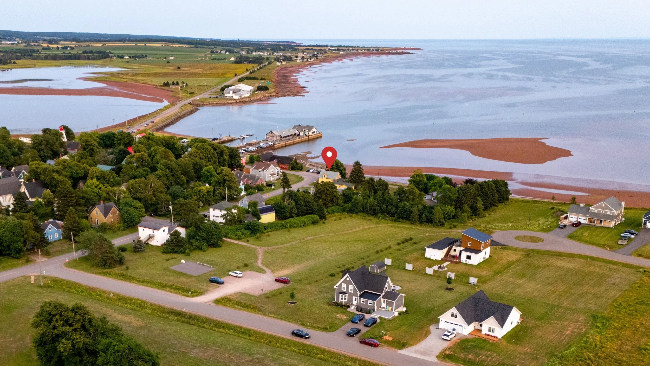 Aerial view of picturesque Victoria-by-the-Sea, PEI including the wharf and waterfront area of the town.  