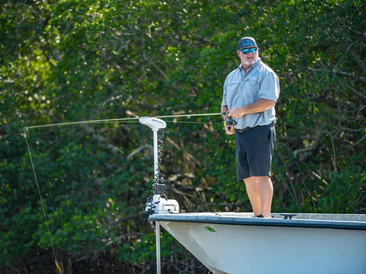 Angler on Bow with Rod
