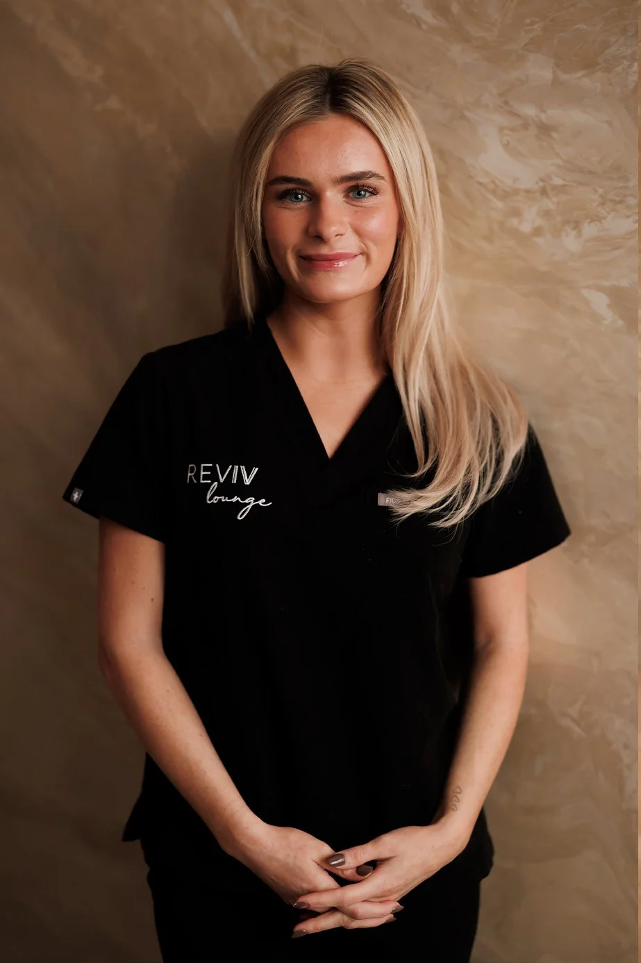 Evie is an esthetician at Reviv who performs facials, laser treatments, and diamondglow facials