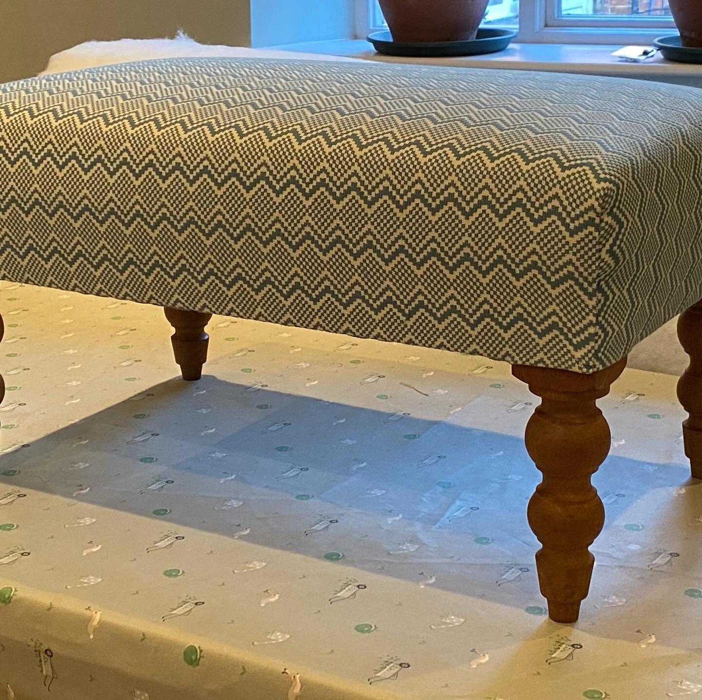 Recovered footstool, love the fabric
