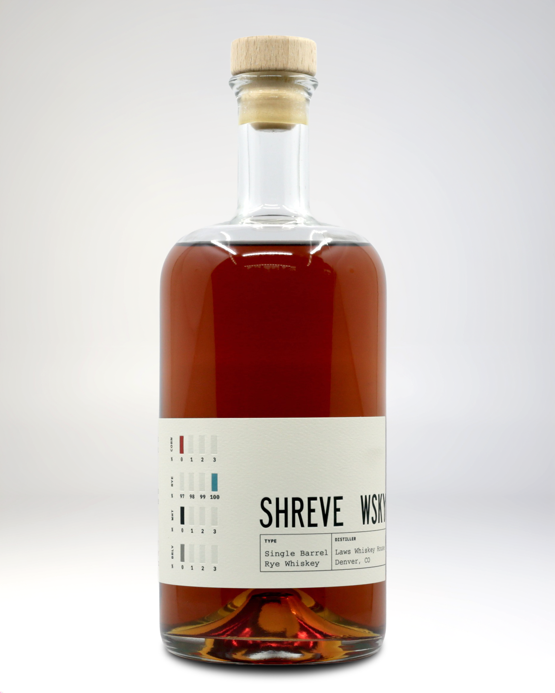 A glass bottle of rye whiskey with a wooden cap, labeled 'SHREVE WSKY,' with a color chart and details about the whiskey's type and distiller visible on the label.